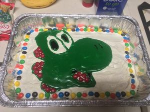 Supporting image for story: This man’s wife makes him a Yoshi birthday cake every year, but never QUITE manages to pull it off