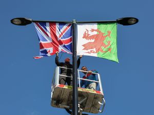 Supporting image for story: Group use cherry picker to erect over 40 UK flags on West Midlands lampposts along entire street