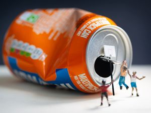 Supporting image for story: Tiny figures explore Irn-Bru cans in school project assisted by top photographer