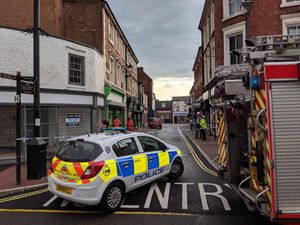 Supporting image for story: Man trapped under debris after shop floor collapse