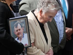 Supporters of the family of GAA official Sean Brown with widow Bridie Brown outside Belfast’s Court of Appeal