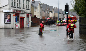 People were ordered to stay back behind the flood water in Park Lane West. Picture: Tim Thursfield