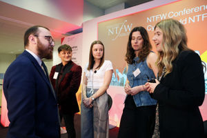 Marketing assistant apprentice Elinor Jones talking to Skills Minister Jack Sargeant at the conference
