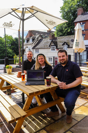 Paul Biddulph from Information Solutions with  Callum Jinks and Georgia Charlton-Briggs from Joules Brewery toasting the new IT provider partnership at The Stag, Market Drayton.