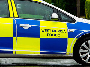 Supporting image for story: Van rolls on its side in crash
