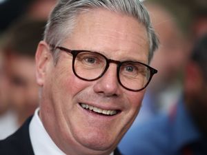 Sir Keir Starmer smiles