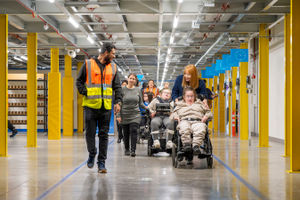 Jamal Qurban with Saxon Hill Academy staff and pupils