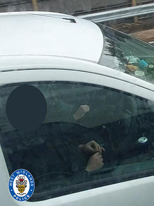 This driver was rolling a joint while behind the wheel on the M6