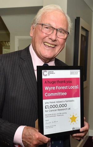 Honorary life president Peter Tomlinson with the £1m certificate

