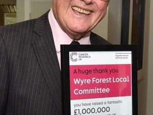 Honorary life president Peter Tomlinson with the £1m certificate

