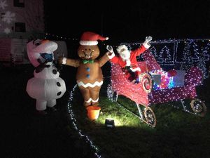 Supporting image for story: Children in Seventh Heaven at drive in Christmas lights