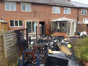 Supporting image for story: Conservatory and fence wrecked in Bloxwich garden fire