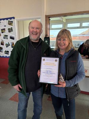Trudy Winwood who supports Tasley Toddlers is handed an award by the Lions