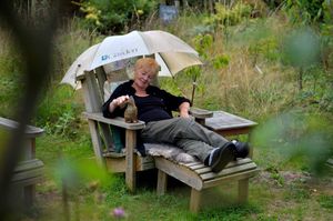Elen sitting in her garden