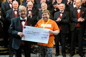 Lawton Morris from the Choir presenting a cheque to Barbara Soden, Vice Chair of the Shropshire Kidney Patient Association