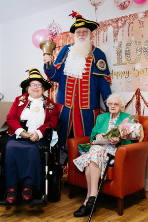 Beryl Morris celebrates her 100th Birthday at Ideal Care Home in Shrewsbury. In Picture L>R: Shrewsbury Town Crier Wife Sue Wood, Shrewsbury Town Crier Martin Wood and Beryl Morris..