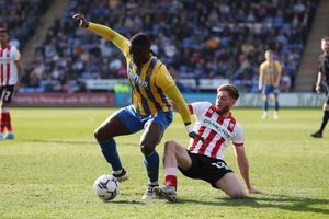 Dan Udoh of Shrewsbury Town and Ted Bishop of Lincoln City (AMA)