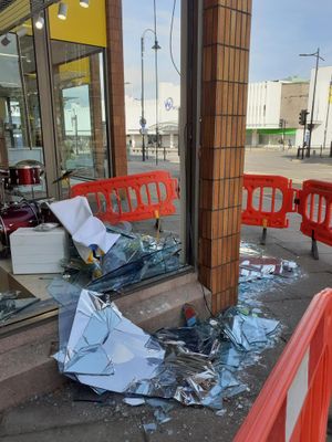 Two large windows at Compton Care's retail superstore were smashed in. Photo: Compton Care