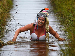 Supporting image for story: Bog Snorkelling Championships: Swimmers dive in for one of world's most bizarre sports