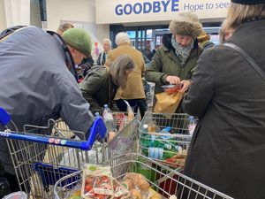  Campaigners removing the plastic