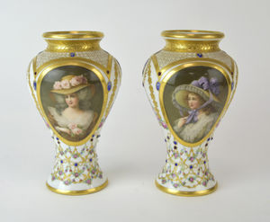 The Vienna style porcelain baluster vases which sold for £2,200.