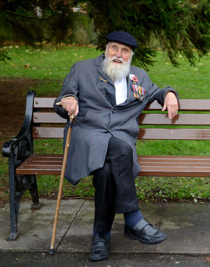 George Evans takes a seat in Wellington church yard after a Remembrance Service