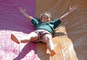Pheobe Carr, aged 8, enjoys the bouncy slide at Gornal Fun Day