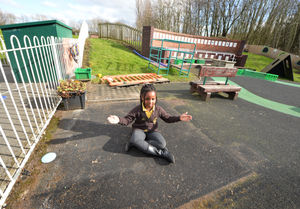 Pupil Ogonna, aged 5, sitting where the playhouse was taken