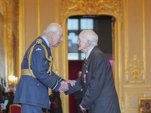 George Kelly shaking hands with the King at Windsor Castle