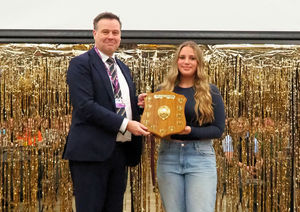 Belle Phillips receives the work experience student of the year shield from Lawrence Wood of Telford College