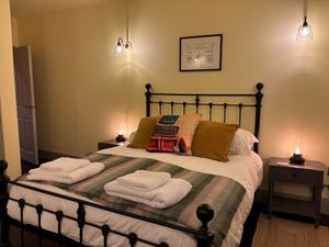Yellow bedroom, featuring lights that copy the Victorian period rooms.