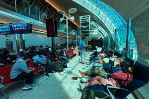 Passengers at Dubai International Airport. (Photo by -/AFP via Getty Images)