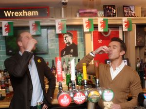 Supporting image for story: William downs shot and pulls pint during Wrexham football club visit