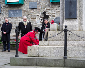 Knighton Mayor Councillor Chris Branford laying a wreath at the war memorial on behalf of the town council and the town. (Image: Jim Saunders)