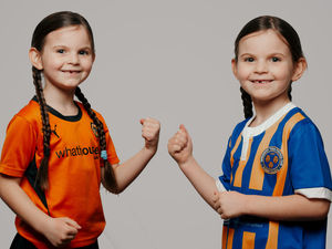 Supporting image for story: Shrewsbury Town v Wolves: Family split as Daisy, 7, is torn between clubs 