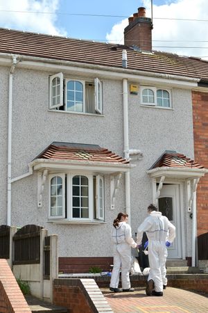 Officers in forensic suits
