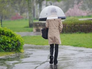 People walking in the heavy rain.