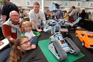 SANDWELL COPYRIGHT EXPRESS AND STAR STEVE LEATH 30/04/2022..Pics of a Lego event, the Black Country Brick Show, at Phoenix Collegiate Academy in West Bromwich.  Short Cicuit made by Chris Radbone from Buckingham (at the back), Family: Terry Clough and Sammy 7 and Evie 10 take a look..