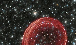 This image provided by Nasa in December, 2010 shows a delicate sphere of gas floating serenely in the depths of space. The bubble is the result of gas that is being shocked by the expanding blast wave from a supernova, the visible remnant of a powerful stellar explosion about 160,000 light-years from Earth.