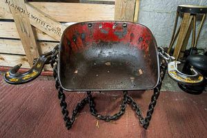 A chair with cup holders made by the talented friends