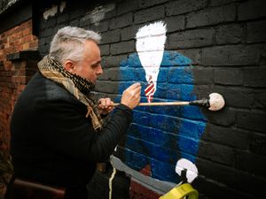 Supporting image for story: Painted Captain Tom mural taking shape at Market Drayton club