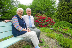 Stuart and Carol Buxton pictured enjoying the views in a peaceful part of their garden at Marehay Farm in Ratlinghope. 