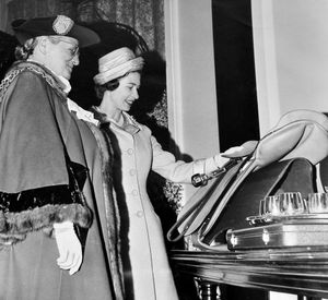 The Queen's visit to Walsall on May 24, 1962: 'The Mayor of Walsall, Councillor Mrs A M M Taylor, shows the Queen the gifts which she was asked to accept for herself and the royal children.' 