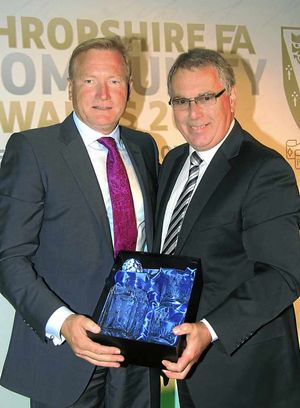 Dave Simpson with an award to guest speaker Richard Bevan