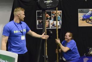 Feddie Flintoff watches Bobby George charging up his electric car 
