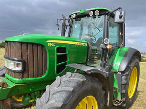 A John Deere 6930 tractor which is included in the auction.
