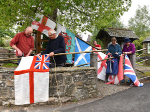 Supporting image for story: Flags fly high as village keeps tradition alive