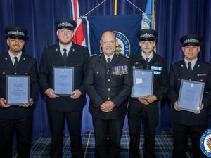 Supporting image for story: Brave police officers receive awards after rescuing residents from burning Birmingham home