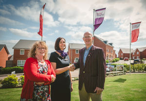 Helen and Time from Uttoxeter RBL photographer with Taylor Wimpey's Tiana following a donation dedicated to VE Day celebration
