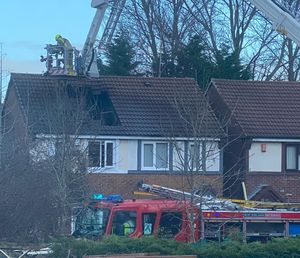 The fire ripped a hole in the roof of the house in Pennyroyal Close, West Bromwich